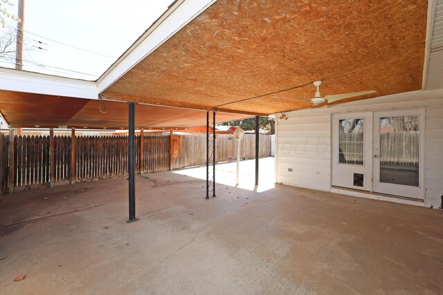 view of patio / terrace with french doors, fence, and ceiling fan