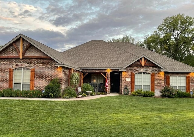 ranch-style house with a front lawn