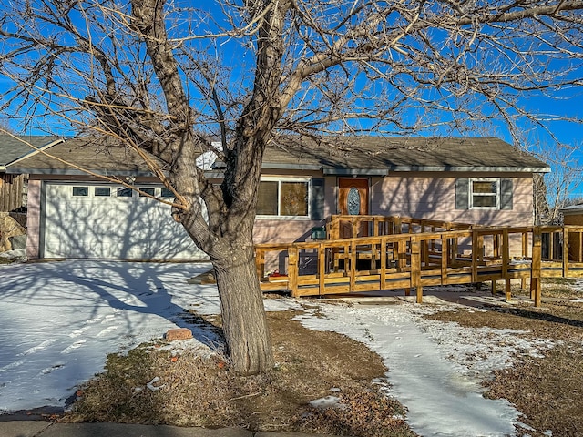 view of front facade with a garage and a deck