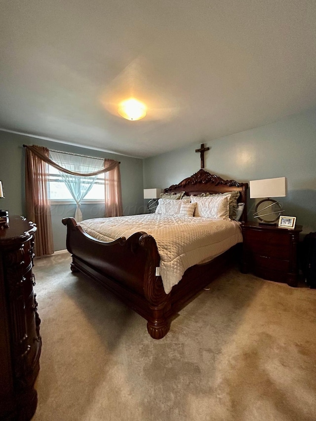 bedroom featuring light carpet