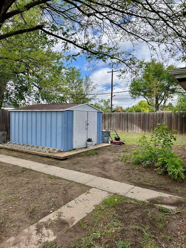 view of shed with fence
