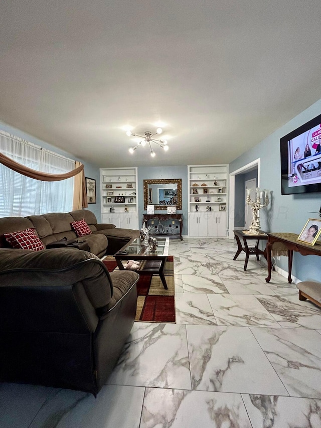 living area with baseboards, an inviting chandelier, built in shelves, and marble finish floor