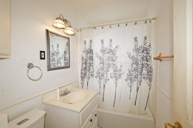 1219 S Kentucky St, Amarillo, TX 79102 - bathroom featuring vanity and shower / bathtub combination with curtain