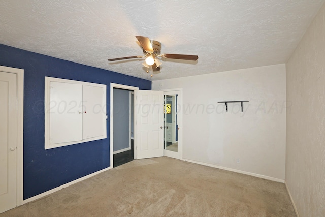 1219 S Kentucky St, Amarillo, TX 79102 - unfurnished bedroom featuring carpet floors, a textured ceiling, and a ceiling fan