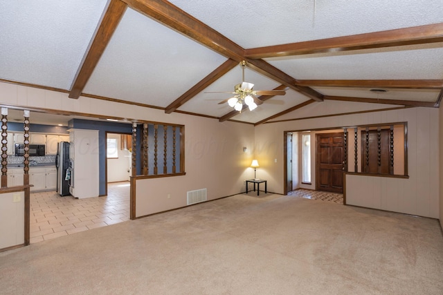 5614 Tranquil Cir, Amarillo, TX 79109 - unfurnished living room featuring a ceiling fan, light carpet, light tile patterned floors, and a textured ceiling