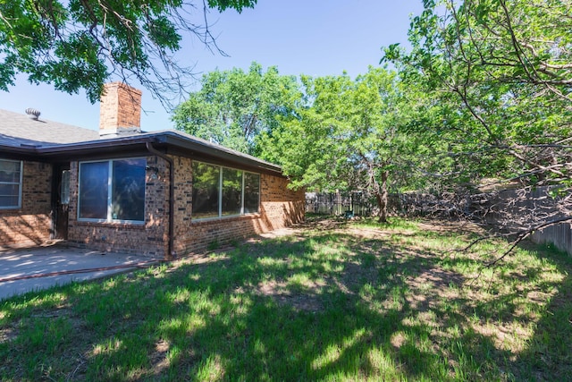 5614 Tranquil Cir, Amarillo, TX 79109 - view of grassy yard with a patio