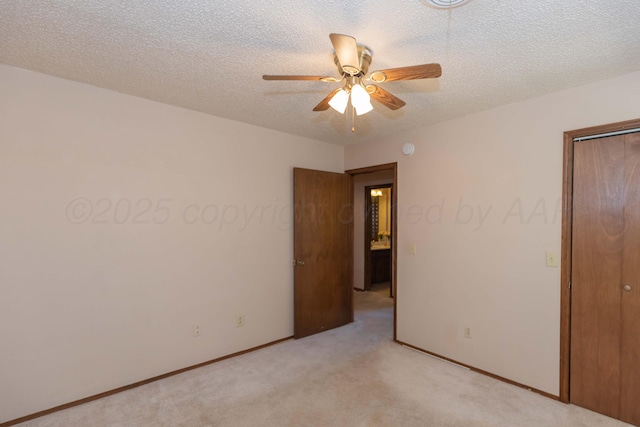 5614 Tranquil Cir, Amarillo, TX 79109 - unfurnished bedroom featuring light carpet, a closet, a textured ceiling, and ceiling fan