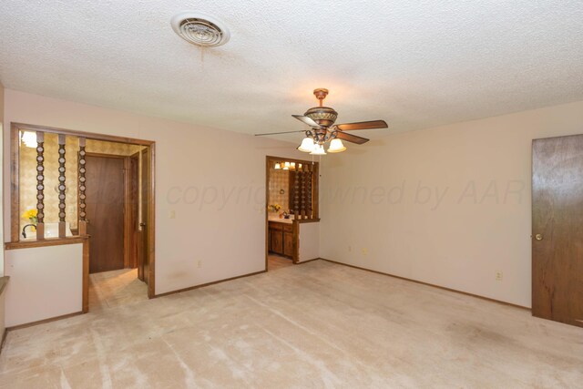 5614 Tranquil Cir, Amarillo, TX 79109 - empty room with a ceiling fan, light carpet, and a textured ceiling