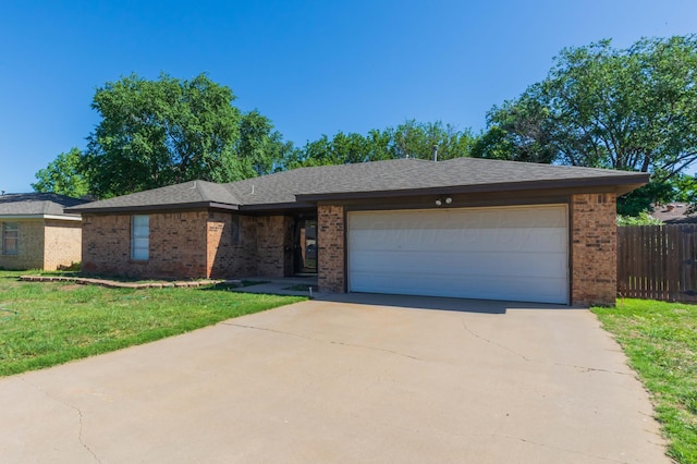 5614 Tranquil Cir, Amarillo, TX 79109 - ranch-style house featuring brick siding, concrete driveway, and a garage