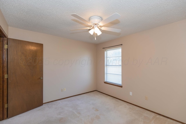 5614 Tranquil Cir, Amarillo, TX 79109 - spare room featuring a ceiling fan, light colored carpet, and a textured ceiling