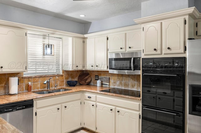 2428 N Fir St, Pampa, TX 79065 - kitchen featuring black appliances, tasteful backsplash, light countertops, and recessed lighting