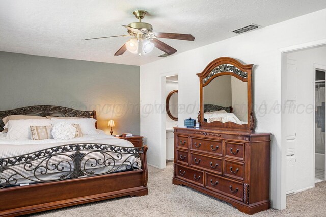 2428 N Fir St, Pampa, TX 79065 - bedroom featuring light colored carpet, ceiling fan, and ensuite bath