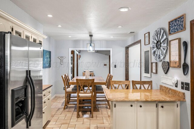 2428 N Fir St, Pampa, TX 79065 - dining room with recessed lighting and stone tile floors
