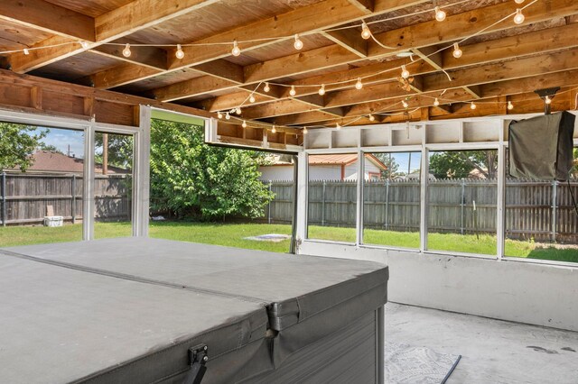 2428 N Fir St, Pampa, TX 79065 - unfurnished sunroom featuring a hot tub