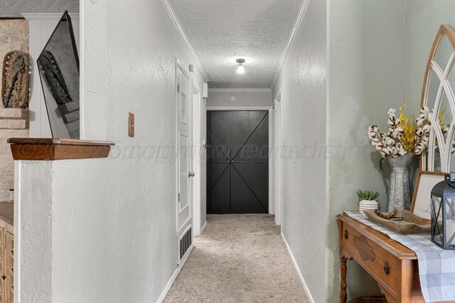 2428 N Fir St, Pampa, TX 79065 - hall with a textured ceiling, carpet flooring, and ornamental molding