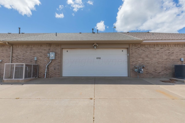6703 Mosley St, Amarillo, TX 79119 - garage featuring concrete driveway and central AC