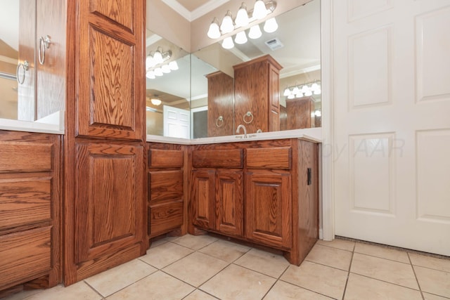 6703 Mosley St, Amarillo, TX 79119 - bathroom featuring crown molding, tile patterned floors, and vanity