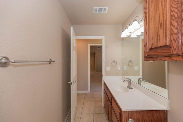 6703 Mosley St, Amarillo, TX 79119 - bathroom with vanity, tile patterned floors, and baseboards