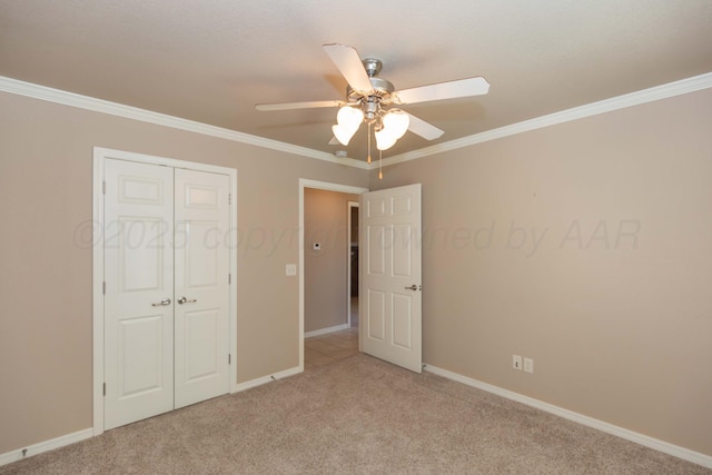 6703 Mosley St, Amarillo, TX 79119 - unfurnished bedroom with light colored carpet, crown molding, baseboards, a closet, and a ceiling fan