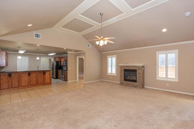 6703 Mosley St, Amarillo, TX 79119 - unfurnished living room featuring light colored carpet, baseboards, lofted ceiling, ornamental molding, and ceiling fan