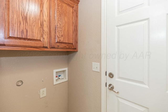6703 Mosley St, Amarillo, TX 79119 - clothes washing area with cabinet space and washer hookup