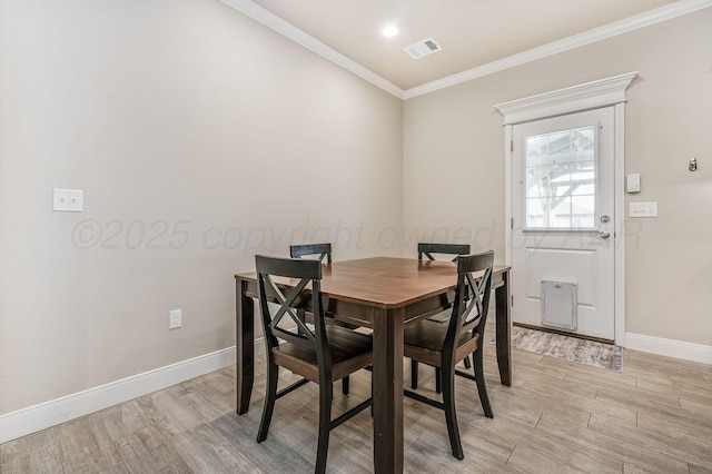 7611 Crestline Dr, Amarillo, TX 79119 - dining room with light wood-type flooring and crown molding