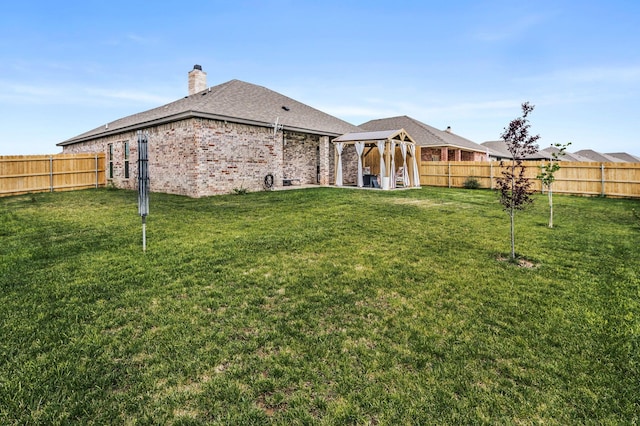 7611 Crestline Dr, Amarillo, TX 79119 - rear view of property featuring a gazebo, a chimney, and a fenced backyard
