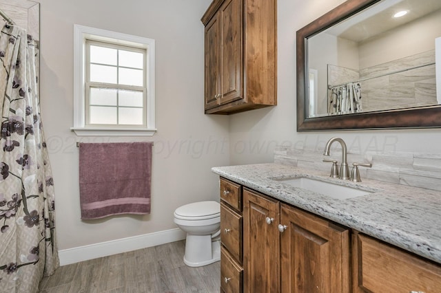 7611 Crestline Dr, Amarillo, TX 79119 - full bathroom with vanity, wood finished floors, and a shower with curtain