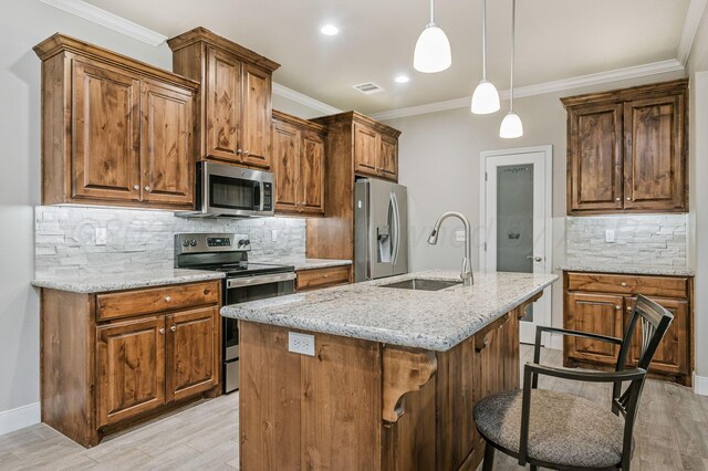 7611 Crestline Dr, Amarillo, TX 79119 - kitchen with appliances with stainless steel finishes, light wood-style floors, tasteful backsplash, light stone counters, and decorative light fixtures
