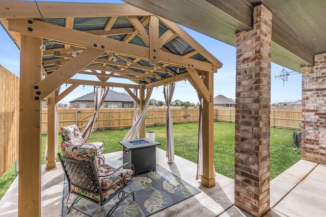 7611 Crestline Dr, Amarillo, TX 79119 - fenced backyard featuring a fire pit, a patio area, and a gazebo