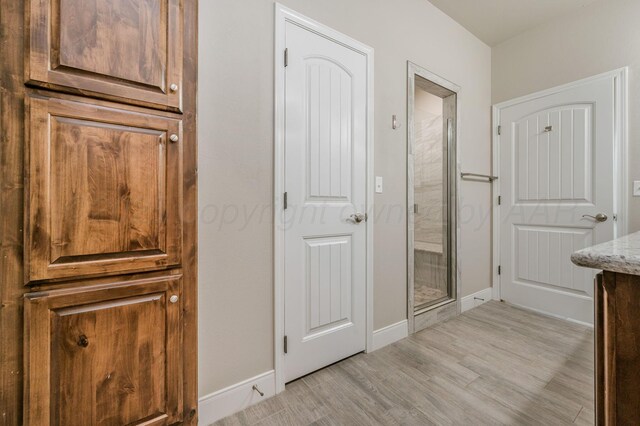 7611 Crestline Dr, Amarillo, TX 79119 - bathroom with wood finished floors and a stall shower