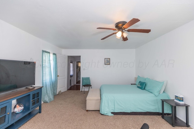 carpeted bedroom featuring a ceiling fan