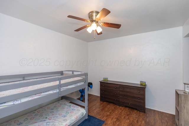 bedroom featuring wood finished floors and a ceiling fan