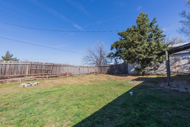 view of yard with a fenced backyard