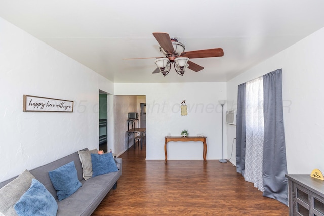 living area featuring wood finished floors and a ceiling fan