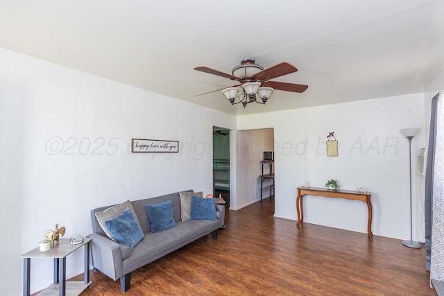 sitting room featuring ceiling fan and wood finished floors