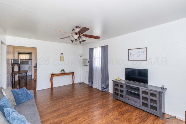 living area featuring a ceiling fan and wood finished floors