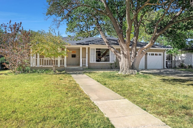 ranch-style home with a garage, a porch, and a front lawn