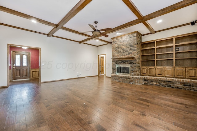 7502 Tripp Ave, Amarillo, TX 79121 - unfurnished living room featuring a ceiling fan, beam ceiling, wood-type flooring, coffered ceiling, and a brick fireplace