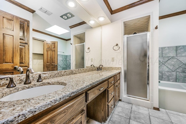7502 Tripp Ave, Amarillo, TX 79121 - full bath with ornamental molding, a stall shower, double vanity, a bath, and a skylight