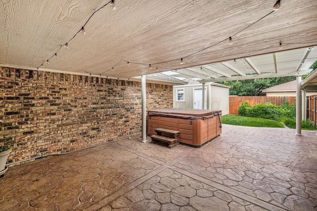 7502 Tripp Ave, Amarillo, TX 79121 - fenced backyard featuring a hot tub and a patio