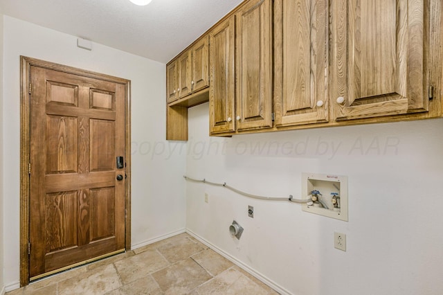 7502 Tripp Ave, Amarillo, TX 79121 - laundry room with cabinet space, hookup for an electric dryer, washer hookup, and light stone finish floors