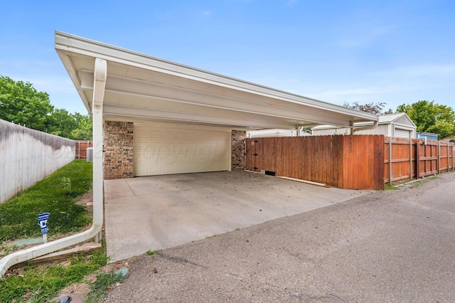 7502 Tripp Ave, Amarillo, TX 79121 - garage featuring a carport