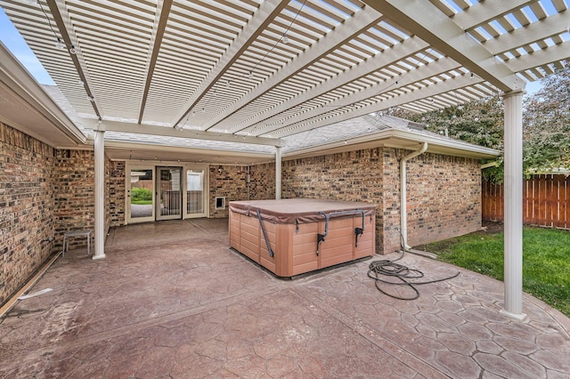 7502 Tripp Ave, Amarillo, TX 79121 - view of patio with a hot tub and a pergola
