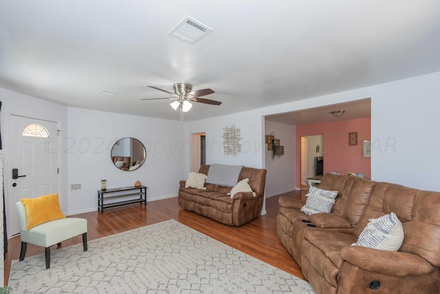 3002 S Polk St, Amarillo, TX 79109 - living area with wood finished floors, a ceiling fan, and baseboards