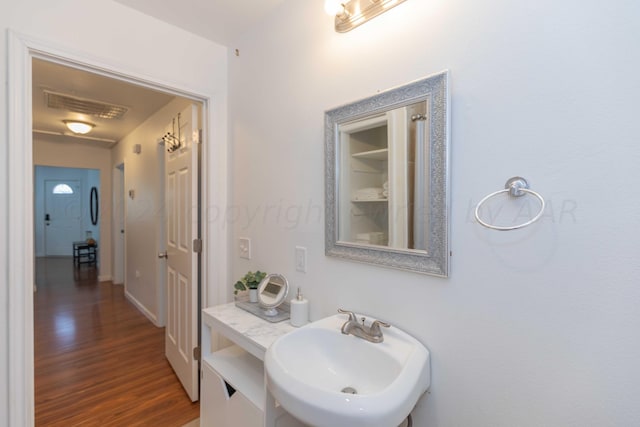 3002 S Polk St, Amarillo, TX 79109 - bathroom with a sink and wood finished floors