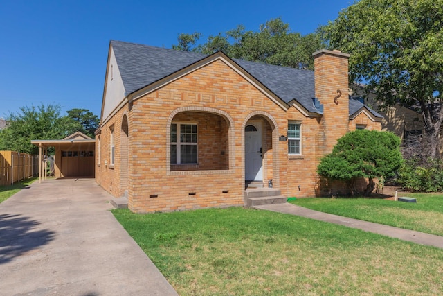 3002 S Polk St, Amarillo, TX 79109 - english style home with brick siding, a shingled roof, a chimney, and driveway