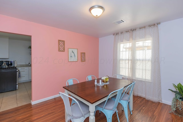 3002 S Polk St, Amarillo, TX 79109 - dining space with wood finished floors and baseboards