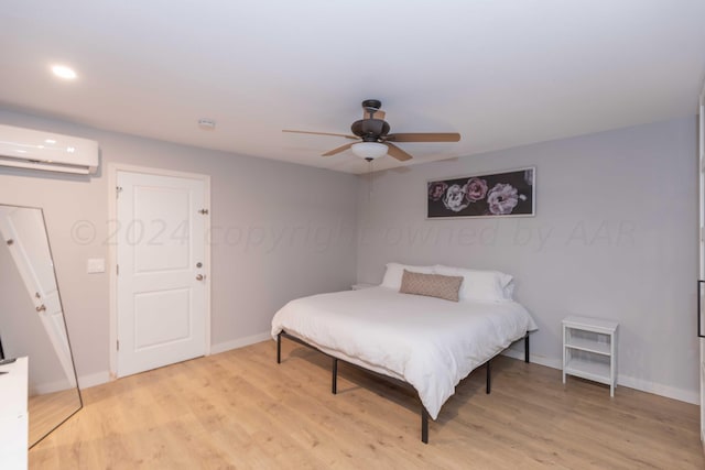 3002 S Polk St, Amarillo, TX 79109 - bedroom featuring a wall mounted AC, baseboards, light wood-type flooring, a ceiling fan, and recessed lighting