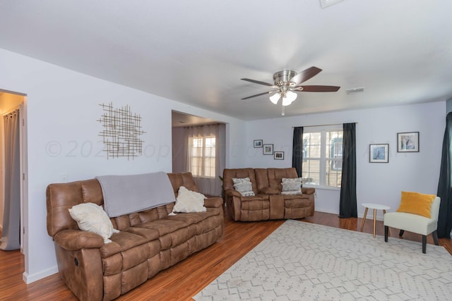 3002 S Polk St, Amarillo, TX 79109 - living room featuring wood finished floors, ceiling fan, and baseboards